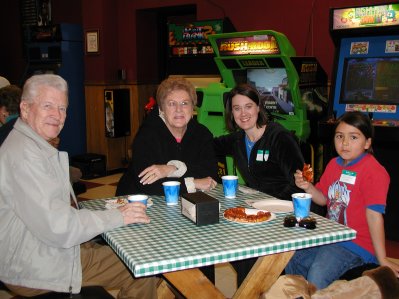 Friends enjoy various types of  pizza at the mixer!