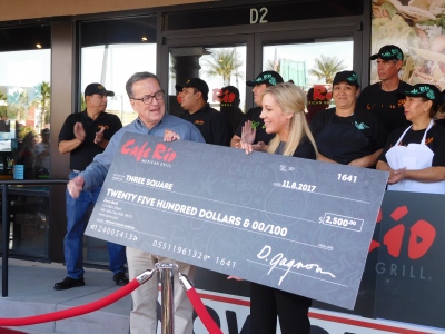 Cafe Rio donating a $2,500 check to Three Square
